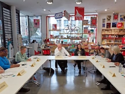 Members of the project seated at a roundtable discussion.