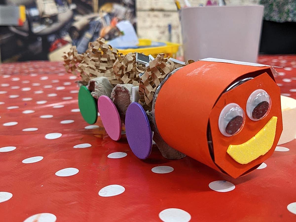 A paper caterpillar made from colourful scrap materials.
